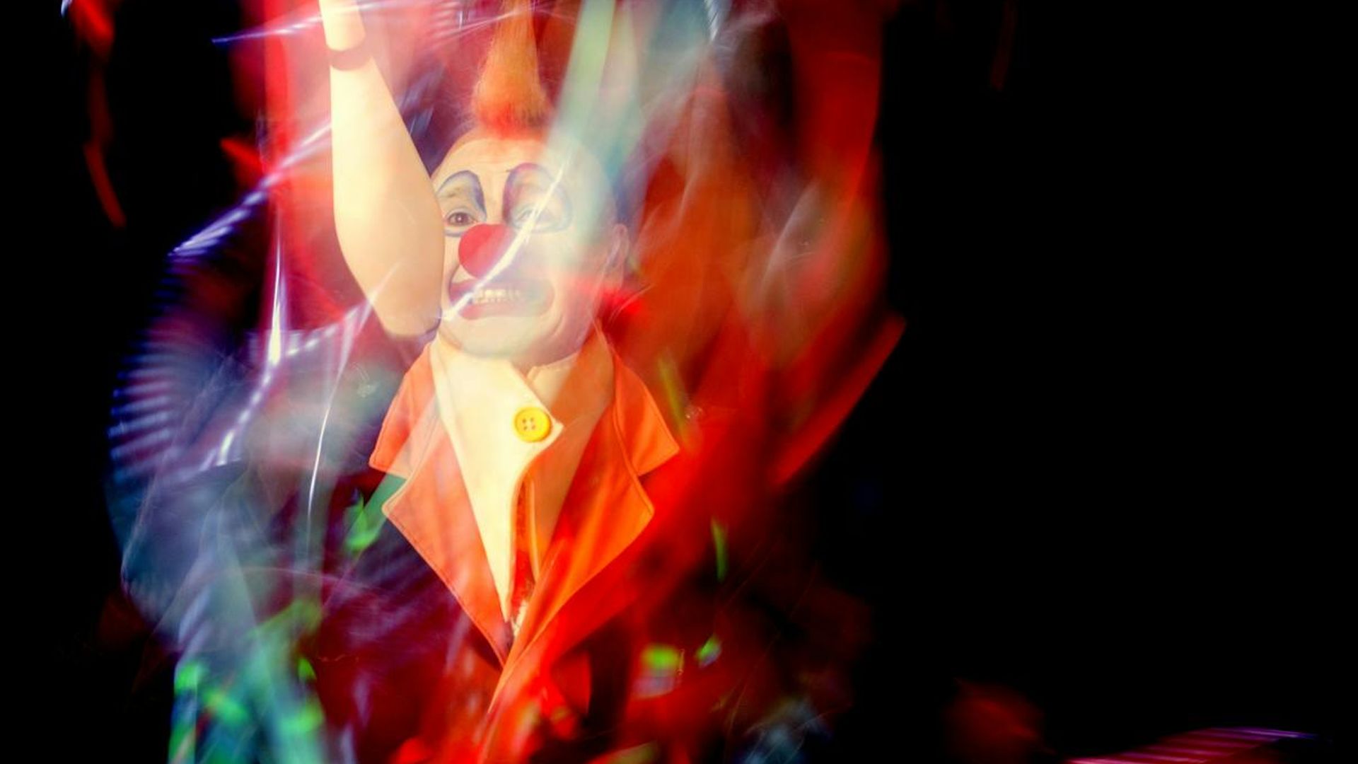 A person performing dynamic movements in a bright spacious studio environment